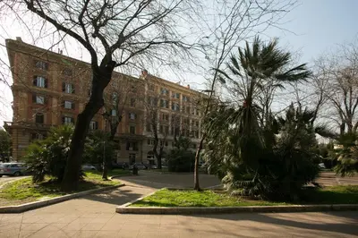 a large brick building with trees in front of it at Cola Di Rienzo A E B in Rome