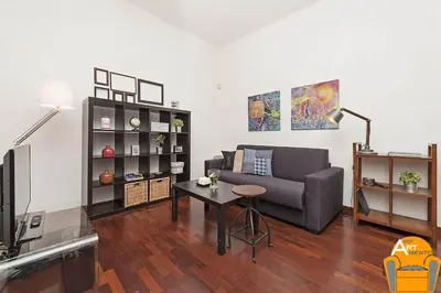 a living room with a couch and a table at 4BNB - Vatican Doors Flat in Rome