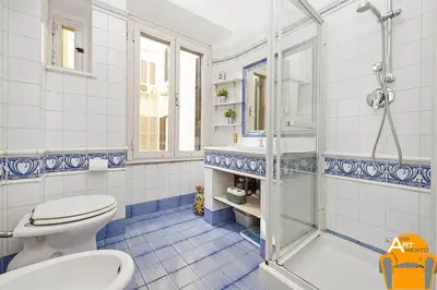 a bathroom with a shower and a toilet and a sink at 4BNB - Vatican Doors Flat in Rome