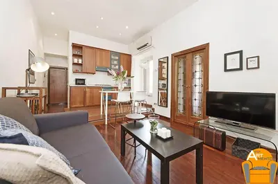 a living room with a couch and a table at 4BNB - Vatican Doors Flat in Rome