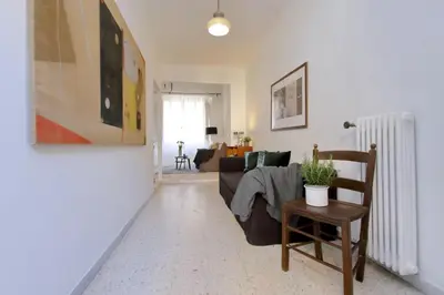 a living room with a couch and a chair at Amleto Apartments in Rome