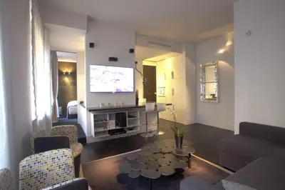 a living room with a couch and a tv at Vatican Modern Apartment in Rome