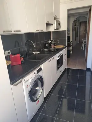a kitchen with a sink and a washing machine at B&B Vaticanrooms in Rome