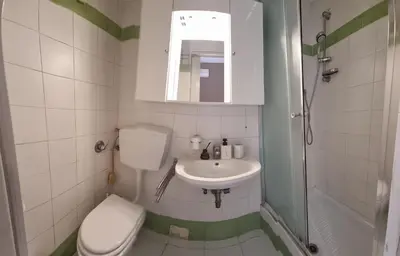 a small bathroom with a toilet and a sink at B&B Vaticanrooms in Rome