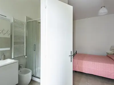 a white bathroom with a bed and a sink at Apartment Il Piccolo by Interhome in Rome