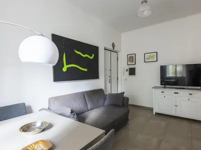 a living room with a couch and a table at Apartment Il Piccolo by Interhome in Rome