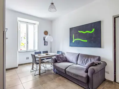 a living room with a couch and a table at Apartment Il Piccolo by Interhome in Rome