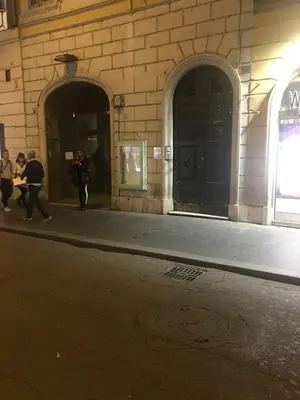 a hallway with an iron gate in a building at Condotti Apartment in Rome