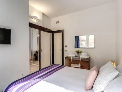 a bedroom with a bed and a table and a desk at Apartment Wohnung mit Wi-Fi by Interhome in Rome
