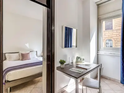 a small bedroom with a bed and a desk at Apartment Wohnung mit Wi-Fi by Interhome in Rome
