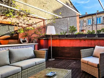 a patio with two couches and a table at Apartment Wohnung Monserrato by Interhome in Rome