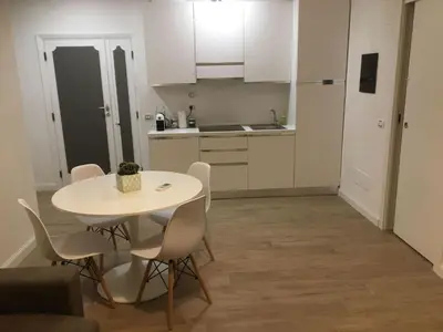 a kitchen with a table and chairs in a room at Apartment GLI ARANCI Wohnung by Interhome in Rome
