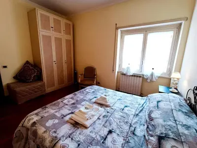 a bedroom with a bed with towels on it at Apartment Rom-Ferienwohnungen - Case Vacanze Roma by Interhome in Rome