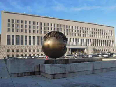 a large building with a large metal ball in front of it at FAIROME Apartment Cassia in Rome