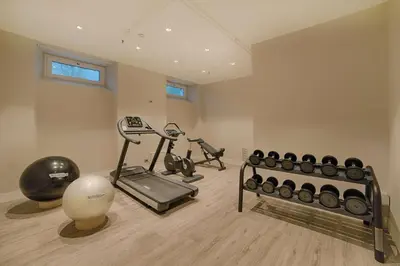 a gym with two exercise bikes and a ball at NH Collection Palazzo Cinquecento in Rome