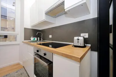 a small kitchen with a sink and a counter at 4BNB - Marmorata Urban Nest in Rome