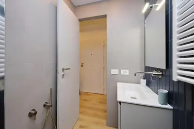 a bathroom with a sink and a mirror at 4BNB - Marmorata Urban Nest in Rome