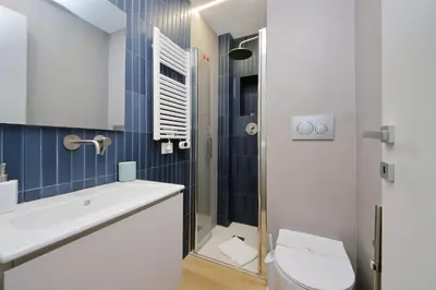 a bathroom with a toilet and a sink and a shower at 4BNB - Marmorata Urban Nest in Rome