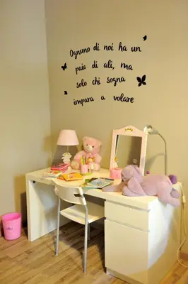 a desk with a mirror and a table with stuffed animals at Alexia Home in Rome