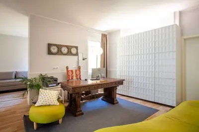 a living room with a desk and a chair at Residenza Cavallini in Rome