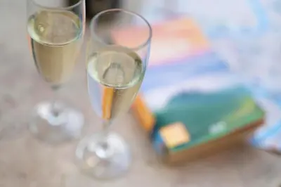 two glasses of white wine sitting on a table at Residenza Cavallini in Rome