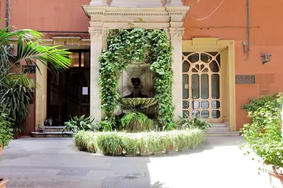 a fountain in the middle of a building at Relais Servio Tullio in Rome