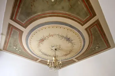 a ceiling in a room with a chandelier at The Right Place 4U Quercia Apartment in Rome