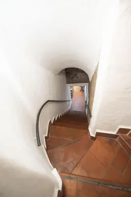 a view of a stairway in an old building at Grotto Apartment by Campo de Fiori in Rome