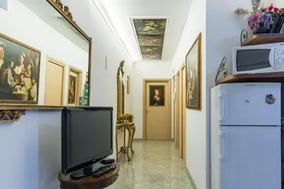 a hallway with a television and a refrigerator at Casavamica in Rome