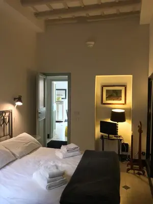 a bedroom with a bed with towels on it at La Casa In Vetrina in Rome