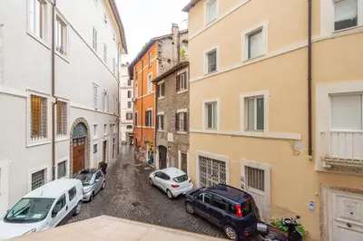an alley with parked cars in an alley between buildings at Shalimar House Navona by Ghor in Rome