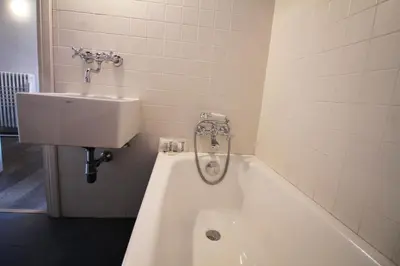 a bathroom with a bath tub and a sink at The Trevi Fountain and Spanish Steps Experience in Rome