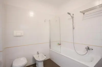 a bathroom with a shower and a toilet and a sink at Polacchi 42 Apartment in Rome
