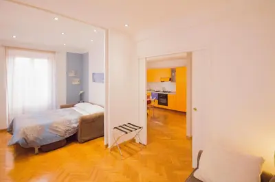 a bedroom with a bed and a large mirror at Polacchi 42 Apartment in Rome