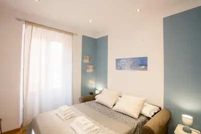 a bedroom with a bed with two towels on it at Polacchi 42 Apartment in Rome