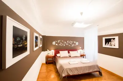 a bedroom with a bed with two towels on it at Polacchi 42 Apartment in Rome