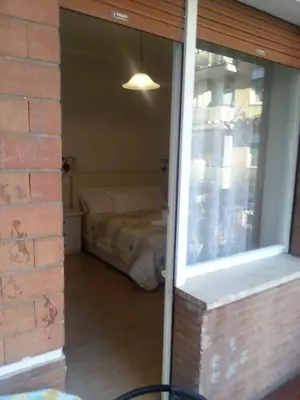 a bedroom through a window with a bed in it at Home Sweet Home in Rome