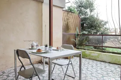 a table and chairs sitting on a patio at 4BNB - Viale Vaticano terrace retreat in Rome