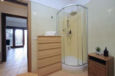a bathroom with a shower with a glass enclosure at 4BNB - Viale Vaticano terrace retreat in Rome