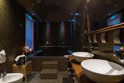 a large bathroom with two sinks and a tub at Colonna Suite Del Corso in Rome