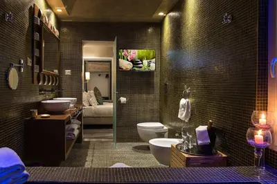 a bathroom with a toilet and a sink at Colonna Suite Del Corso in Rome