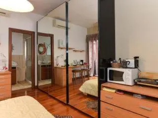 a living room with a microwave on top of a counter at B&B La Terrazza in Rome