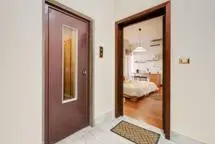 a room with a door and a bedroom with a bed at B&B La Terrazza in Rome