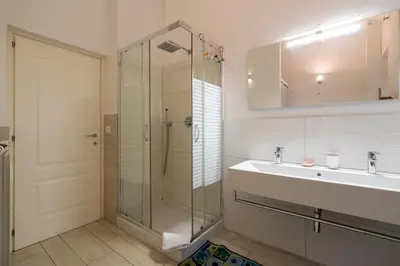 a bathroom with a glass shower and a sink at A 20 Gradini dai Musei Vaticani in Rome