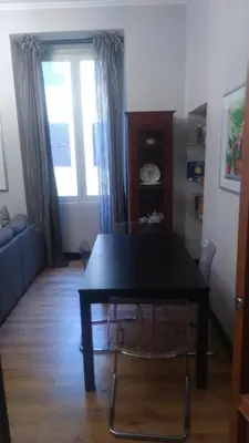 a living room with a table and a couch at YourStay@Rome Coliseum in Rome