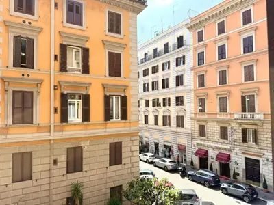 two buildings next to a street with parked cars at Apartment Roman Haven by Interhome in Rome