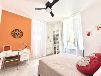 a bedroom with a bed and a desk and a ceiling fan at Apartment Roman Haven by Interhome in Rome