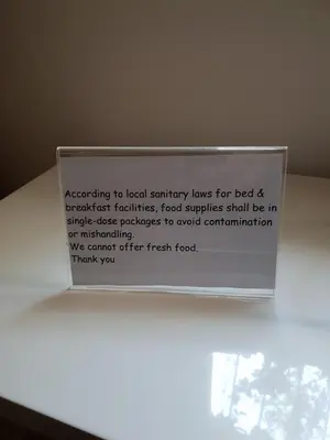 a sign that is on top of a table at Margutta's Garden in Rome