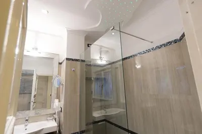 a bathroom with a shower and a sink at Margutta's Garden in Rome