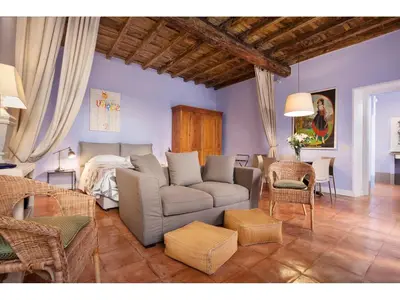 a living room with a couch and a bed at Apartment Via Farina in Rome